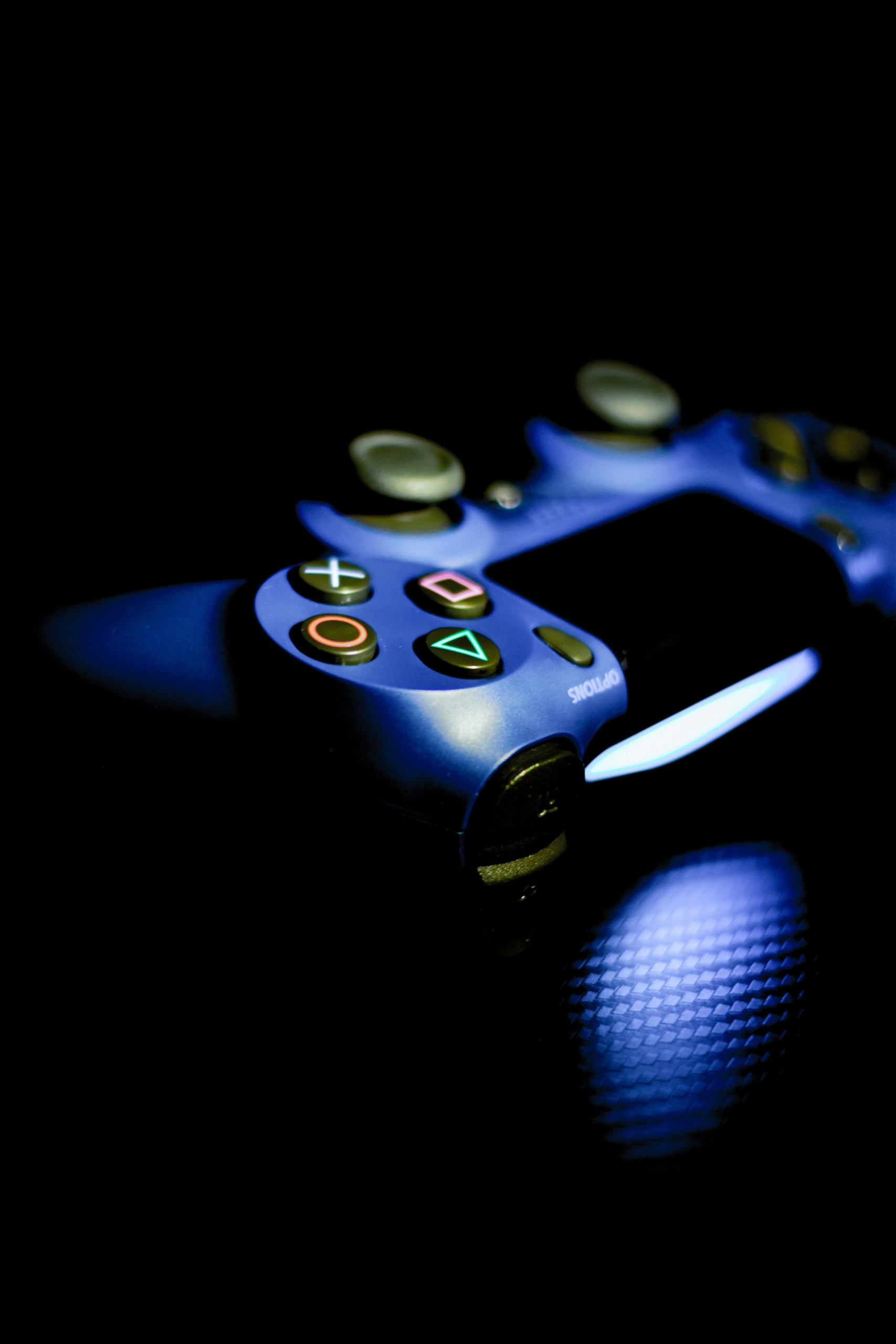 Gaming controller on a desk with neon lighting